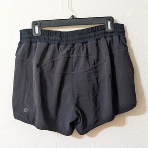 Lululemon Track That mid rise black shorts 12